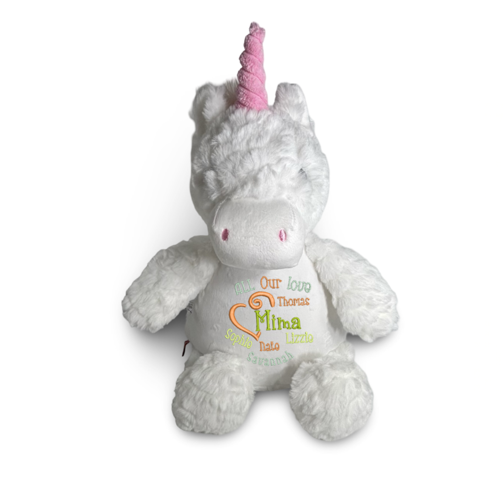 Plush unicorn toy with a pink horn on a white background
