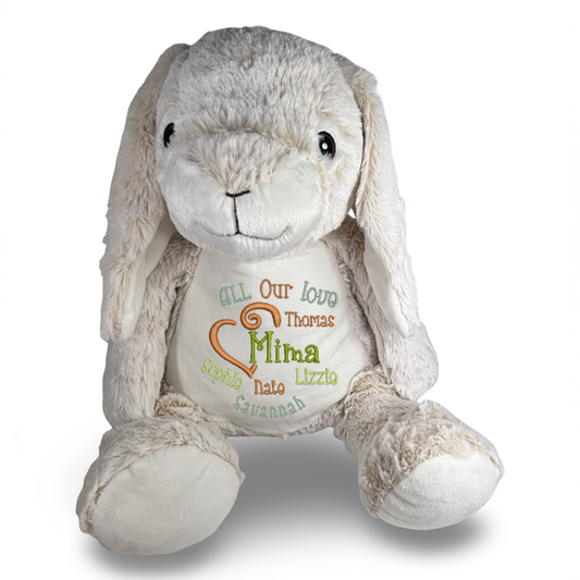 Plush bunny toy with embroidered text on a white background