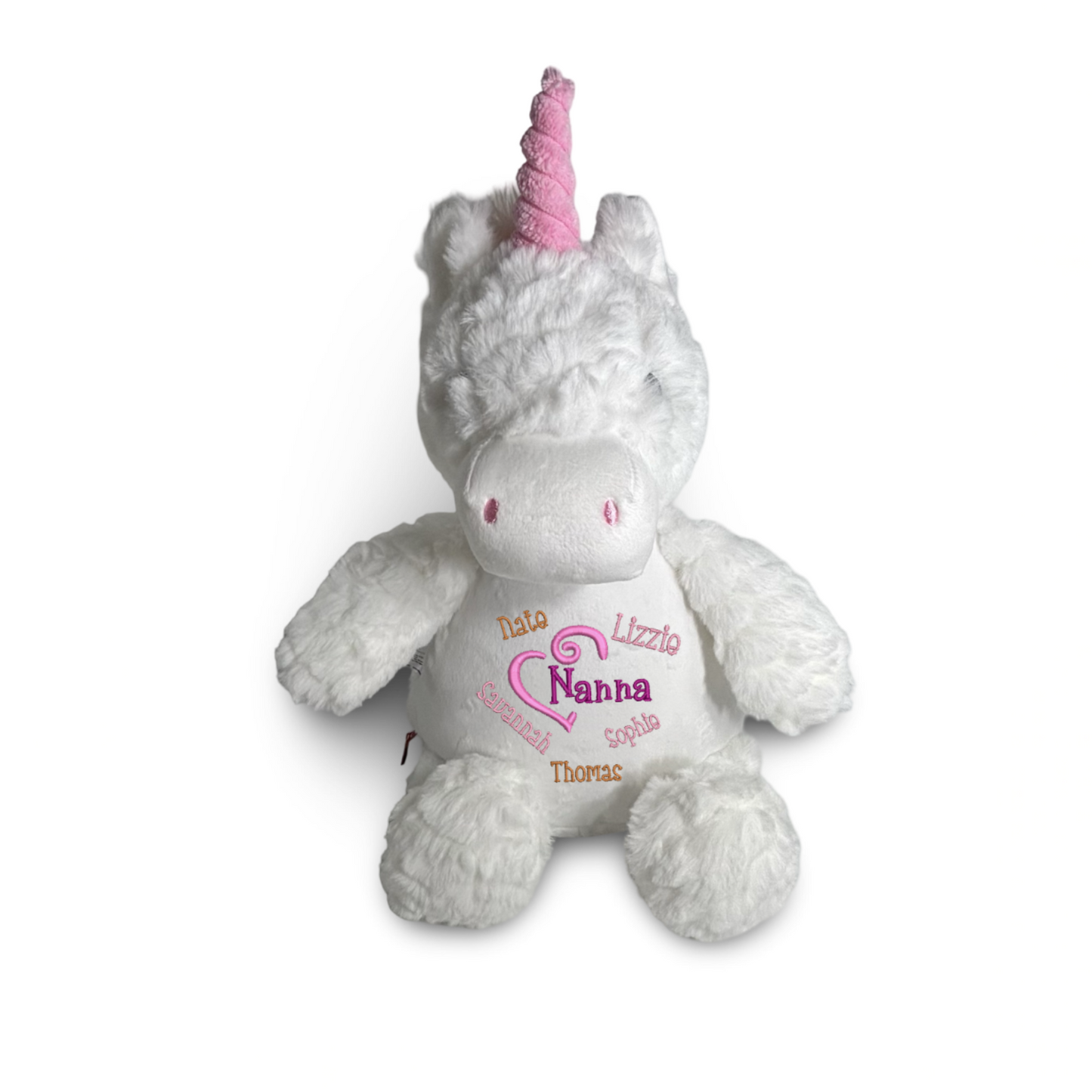 Plush unicorn toy with pink horn and embroidered text on a white background